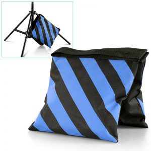 blue and black striped sandbag on white background with inset image showing sandbag draped over light stand leg